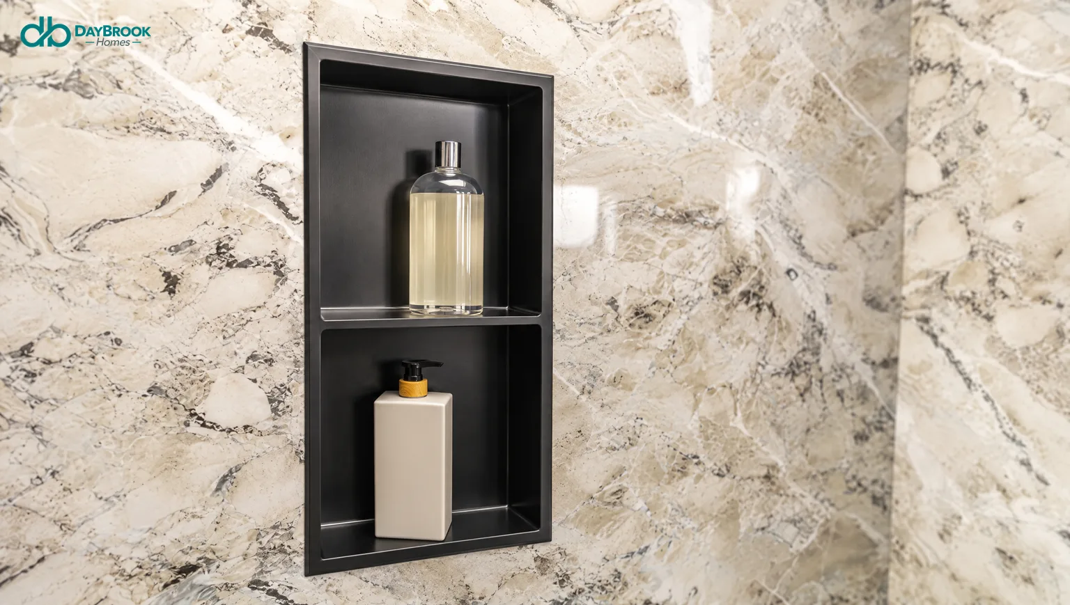 Recessed matte black stainless niche in marble-look shower wall panels